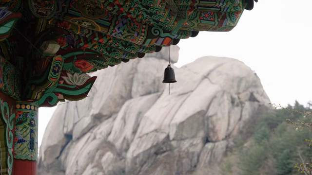 Traditional Korean temple with mountain view