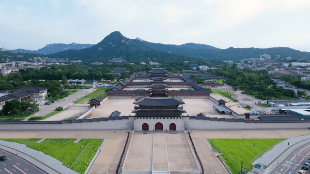 Historic palace with mountains in the background