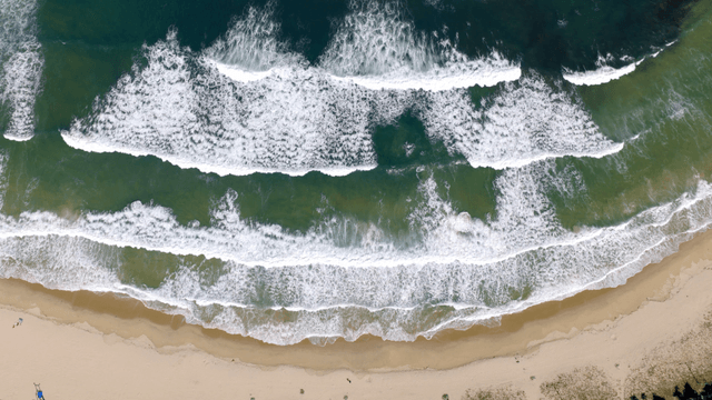 Serene sandy beach with waves