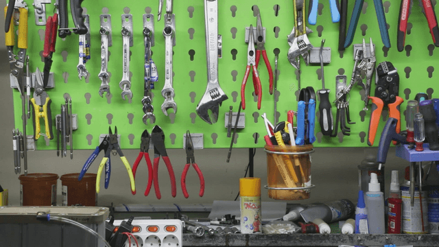 Various tools organized on a workshop wall