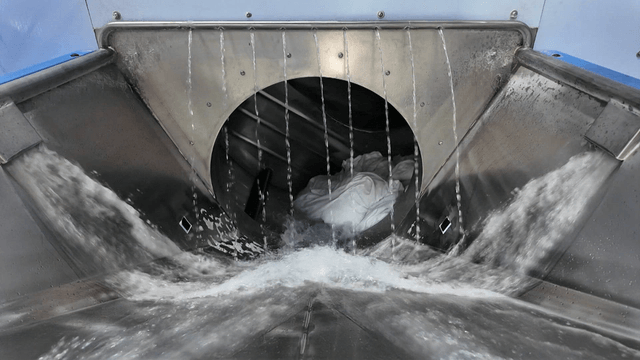Industrial washing machine operating in factory