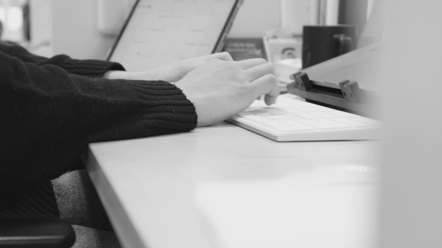 Typing on a keyboard in an office