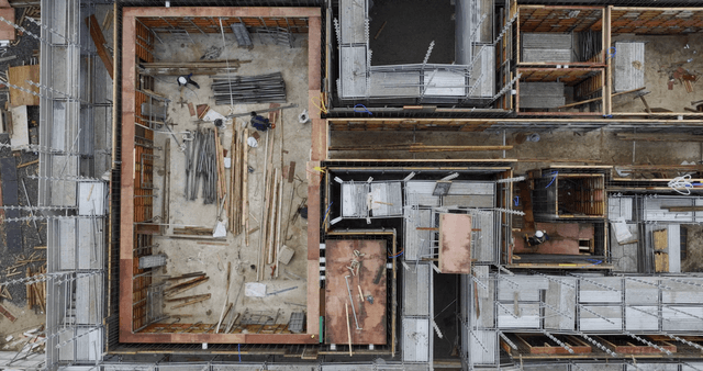 Construction site with workers and materials