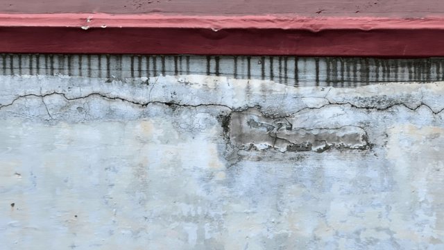 Cracked wall with peeling paint