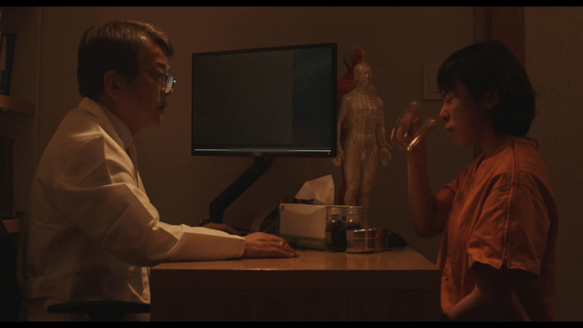 Doctor consulting a patient drinking medicine