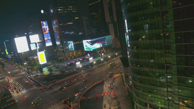 Night view of a bustling city intersection