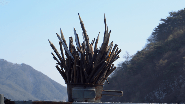 Wooden pencil carving with mountain background