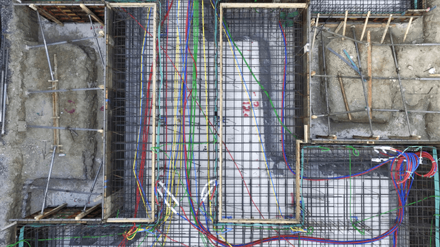 Colorful cables and rebar at a construction site