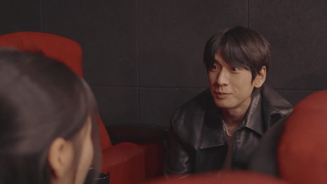 Couple talking under movie theater seats