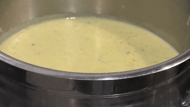 Yellow cream slowly cooling on ice