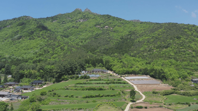Rural village nestled in green mountains