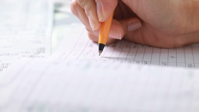 Hand writing on a financial document