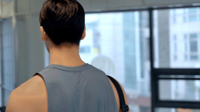 Young man in a gym with exercise equipment
