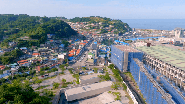 Coastal village with colorful roofs and a harbor