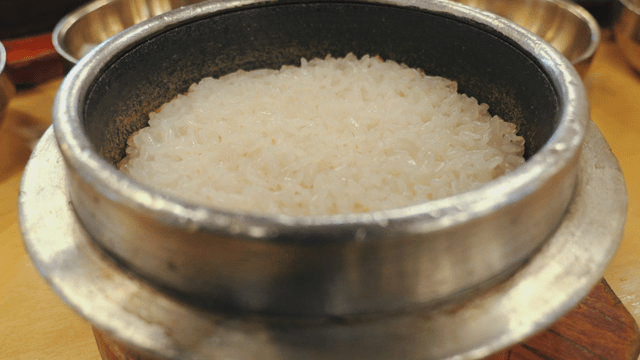 Steamed stone pot rice in a traditional stone pot