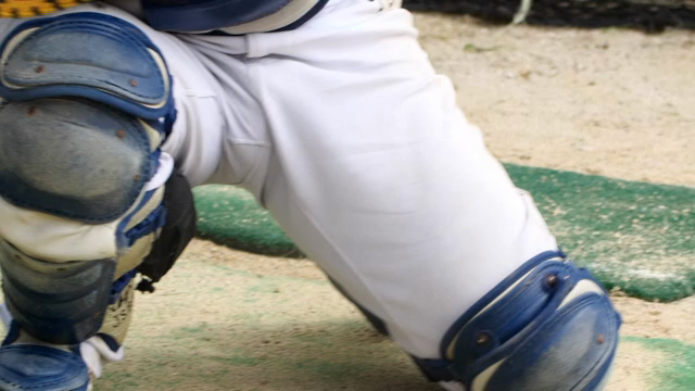 Baseball catcher in protective gear