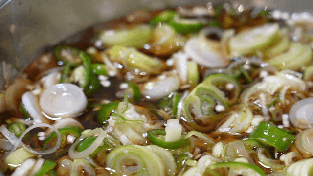 Bowl filled with scallion chili soy sauce