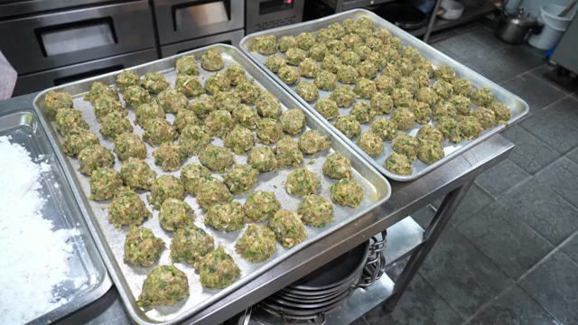 Trays of dumpling filling prepared in a kitchen