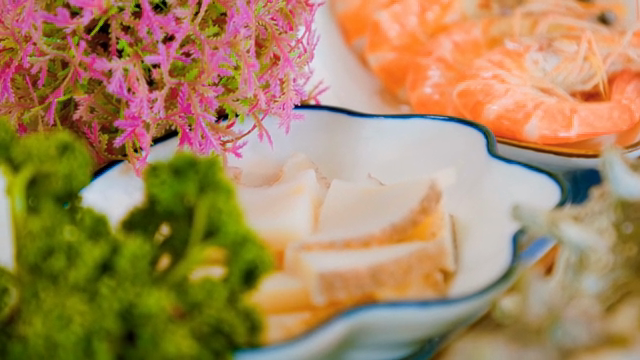 Well-cooked shrimp and abalone on a plate