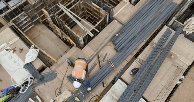 Construction site with workers and materials