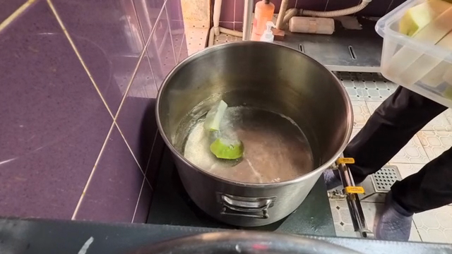 A person preparing radishes in a pot