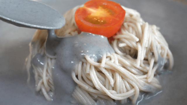 black bean cold noodles topped with cherry tomato