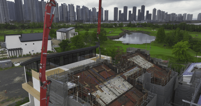 Construction site with skyscrapers nearby