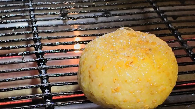 Grilled rice balls on a barbecue grill