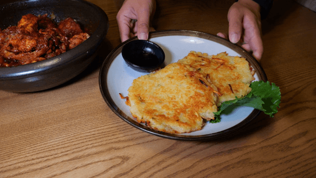 Potato pancake on a wooden table