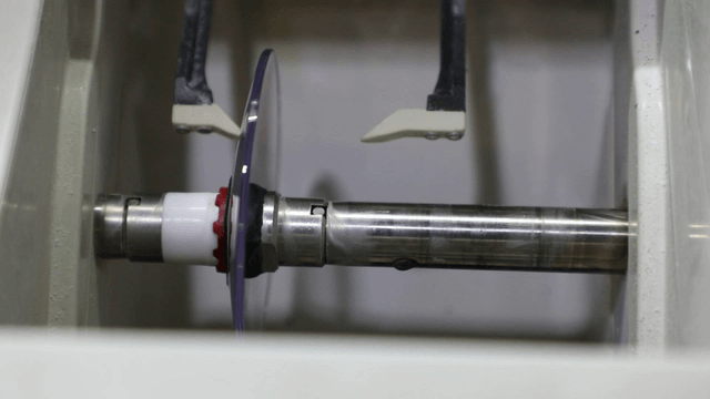 Lens polishing machine in operation