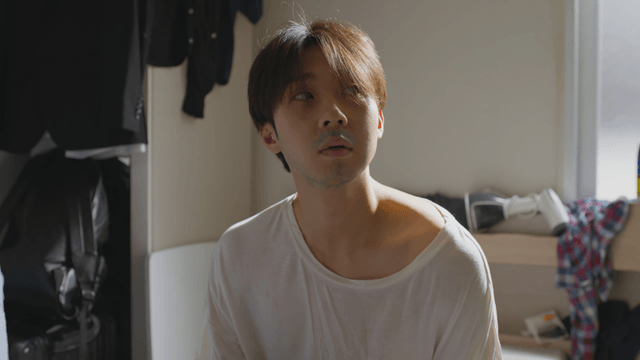 Man sitting in a sunlit room