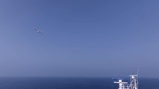 A ship and drone over the ocean