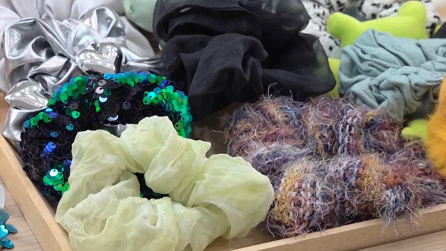 Various hair accessories on a dresser