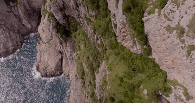 Rocky cliffside with waves crashing below