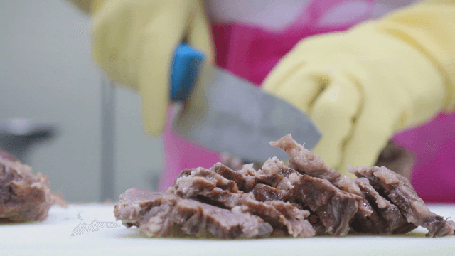 Slicing cooked meat with a knife