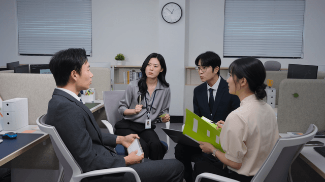 Office meeting with four colleagues