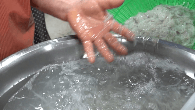 Pile of ice fish washed in large metal basin