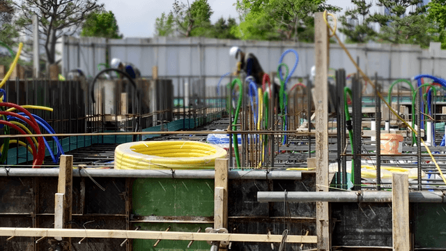 Construction site with workers and equipment