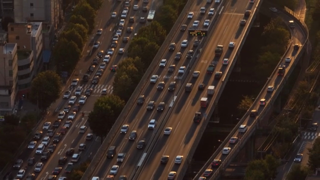 Busy highway with heavy traffic at sunset