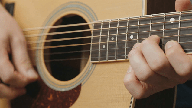 Playing an acoustic guitar with precision