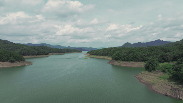 Vast lake surrounded by lush mountains