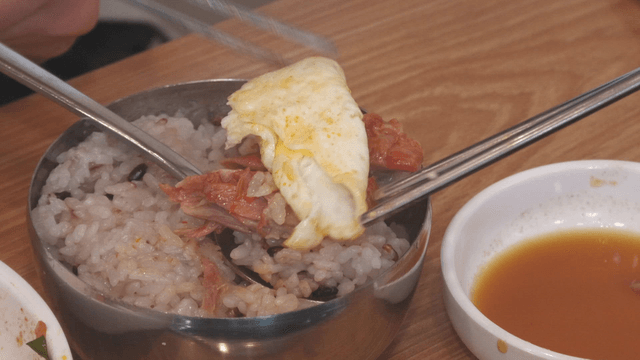 Fried egg and boneless pork back-bone meat placed on rice