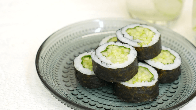 Cucumber gimbap on a glass plate