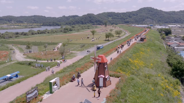 Scenic walkway with people and fields