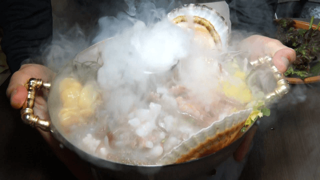 Steaming seafood dish with fresh vegetables