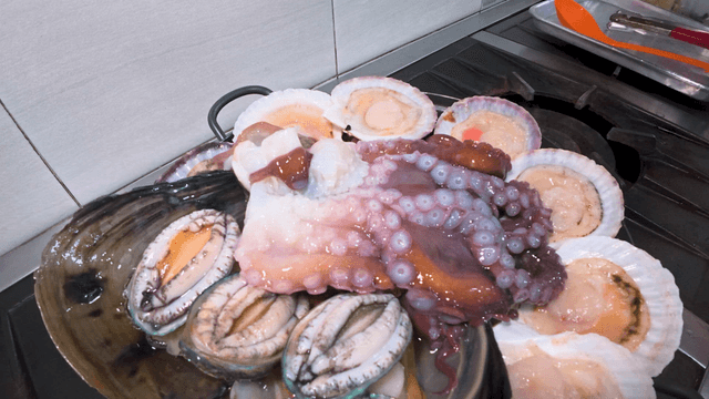 Fresh chicken and seafood soup prepared in the kitchen