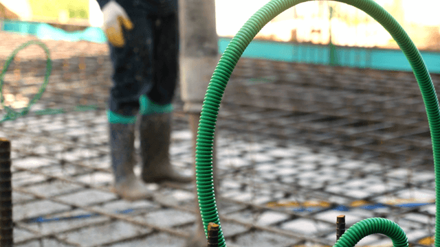 Worker pouring concrete on a construction site