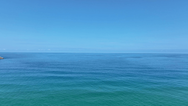 Surfers enjoying the clear blue sea