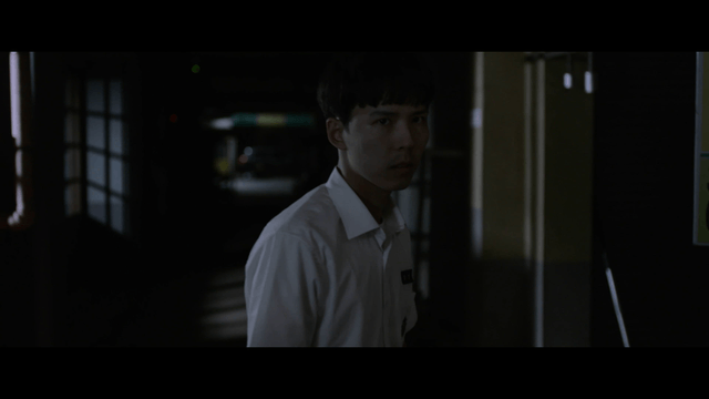 Angry student in dark hallway