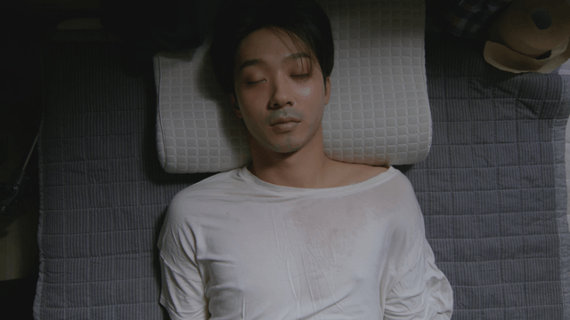 Man sleeping peacefully on a pillow